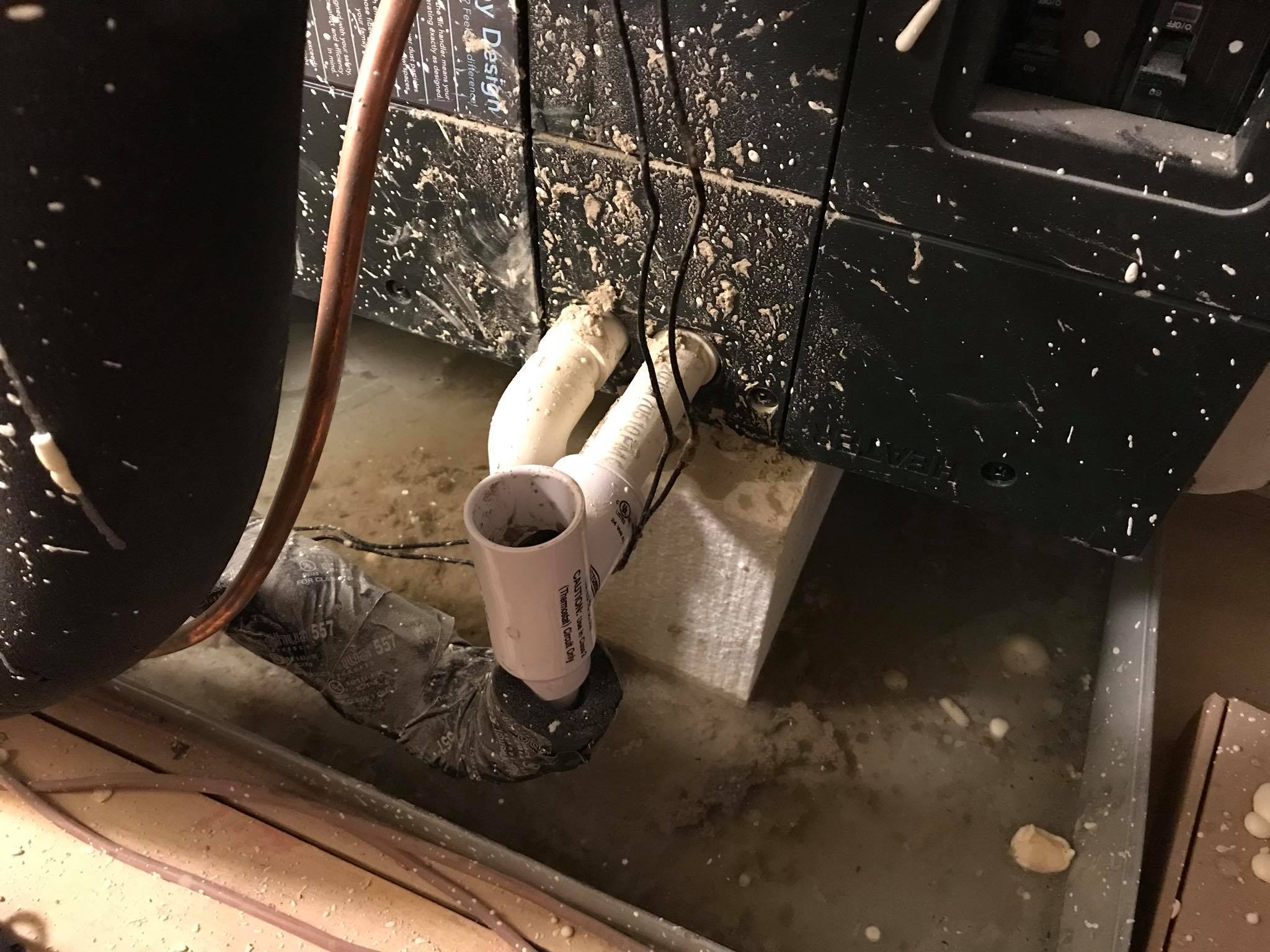 Burned and melted conduit and wiring on an exterior wall — fire damage to HVAC electrical components found during AC repair inspection in Marble Falls, TX