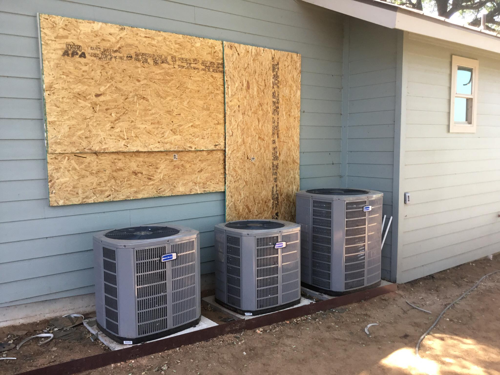 New construction framing with ductwork supply registers being roughed in — duct installation during new home construction in the Highland Lakes region