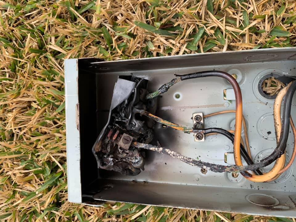 Severely burned AC disconnect panel — why a thorough HVAC inspection matters before and after a system failure